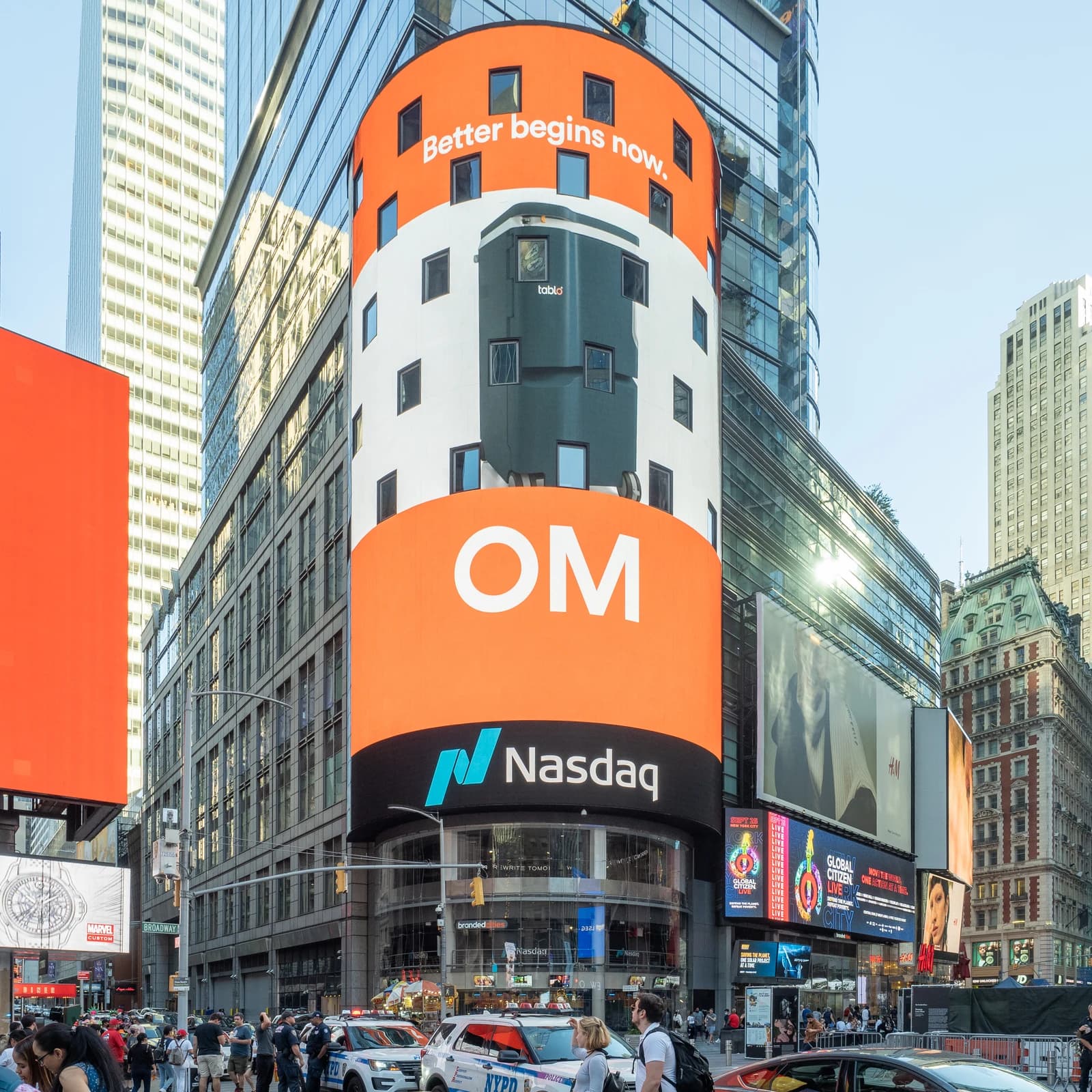 Nasdaq MarketSite building in Times Square featuring large digital billboards and surrounding architecture.