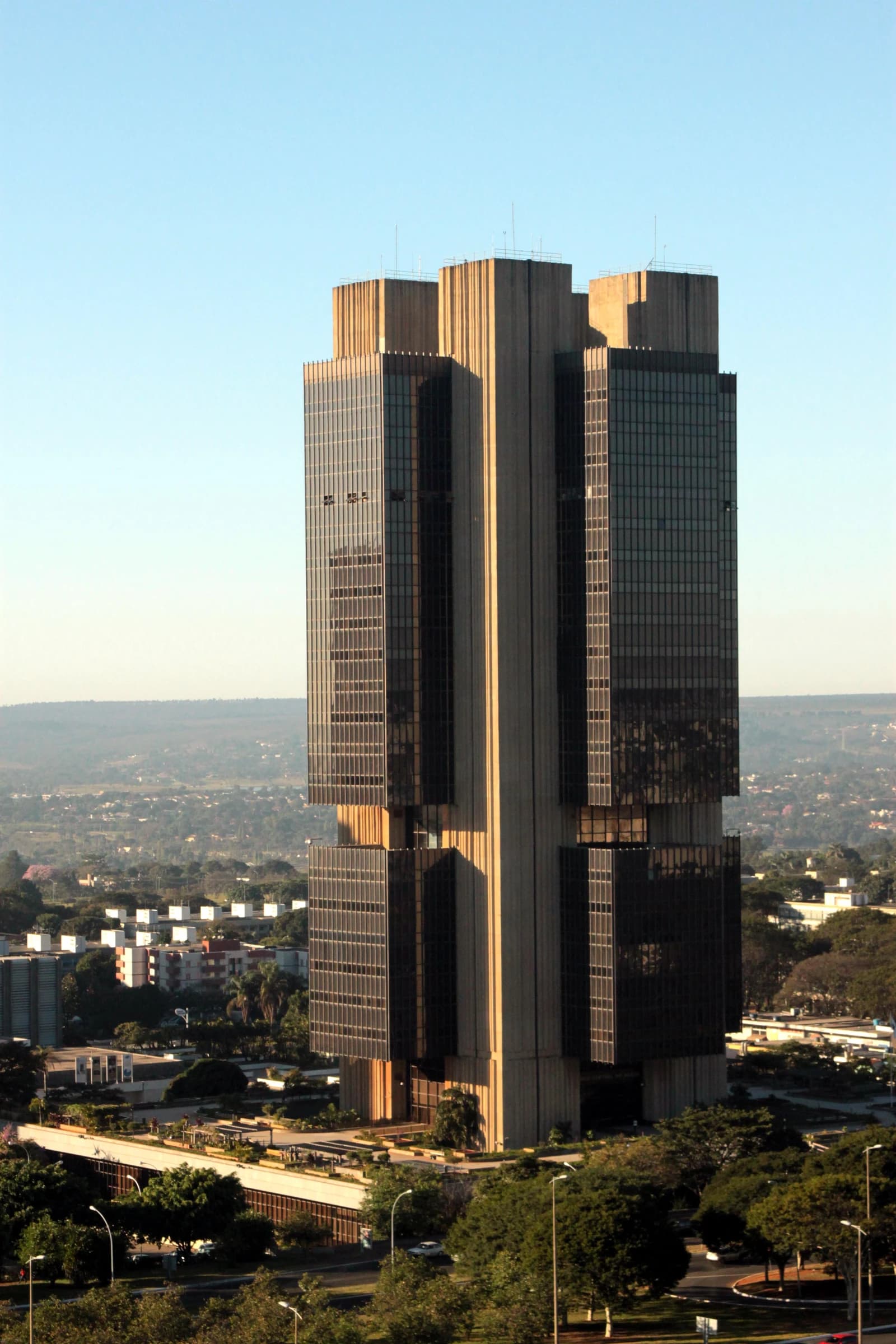 The modernist headquarters building of the Central Bank of Brazil in Brasília under clear skies.