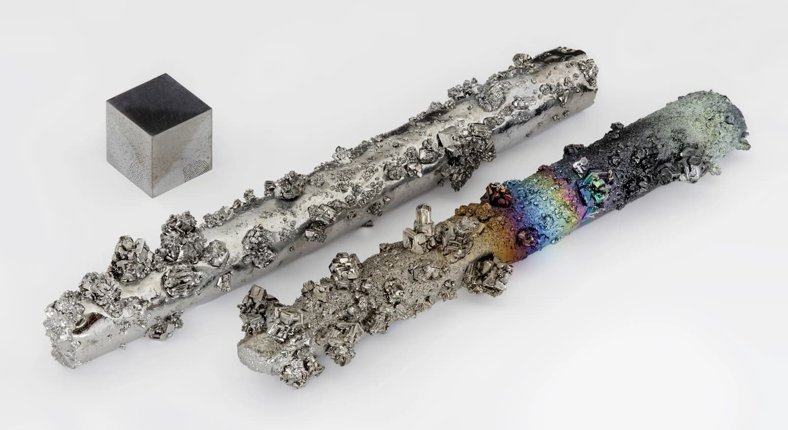 Tungsten evaporated crystals and a one cubic centimeter tungsten metal cube.
