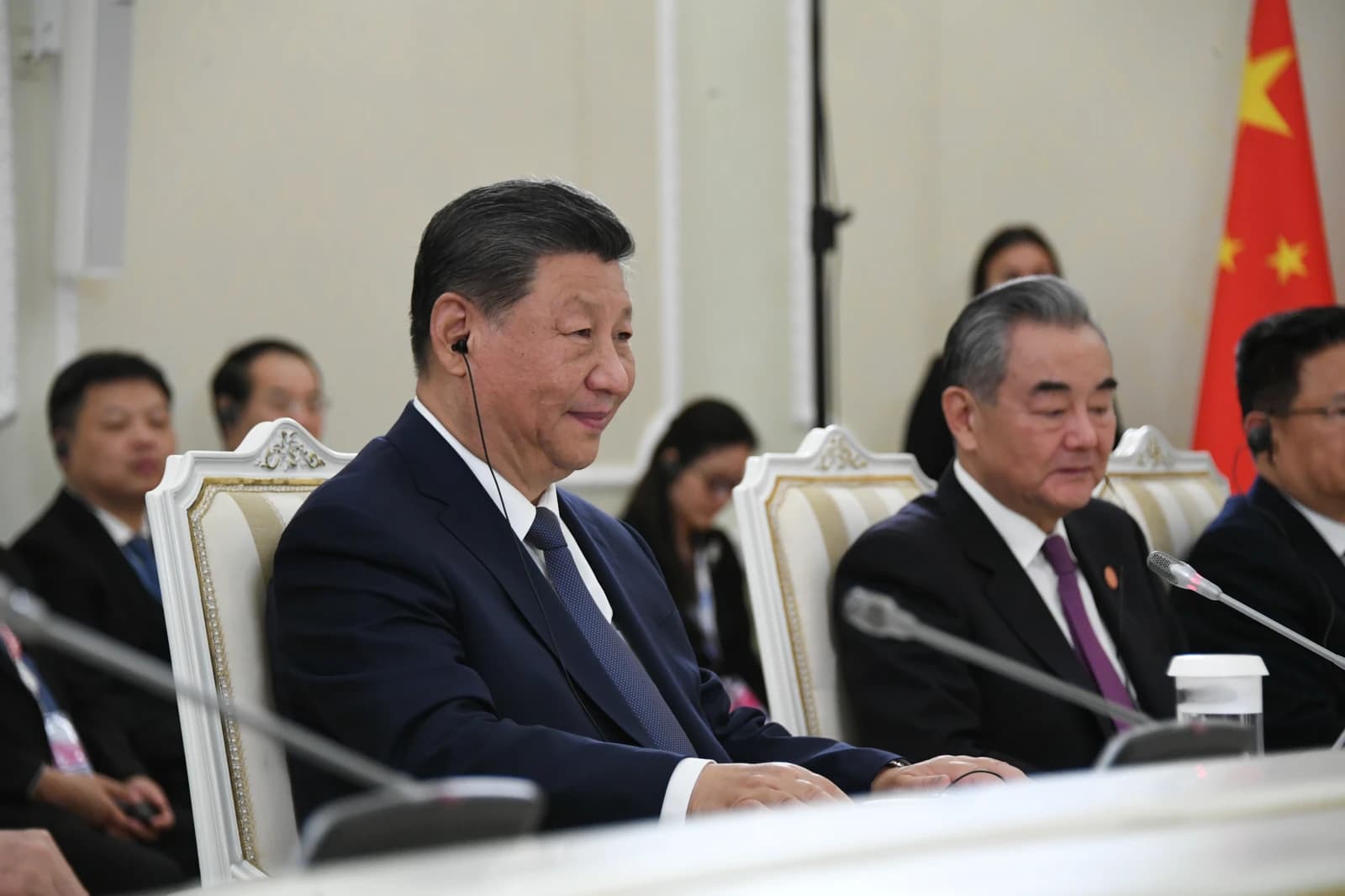 Xi Jinping, President of China, seated at a table during a summit meeting.