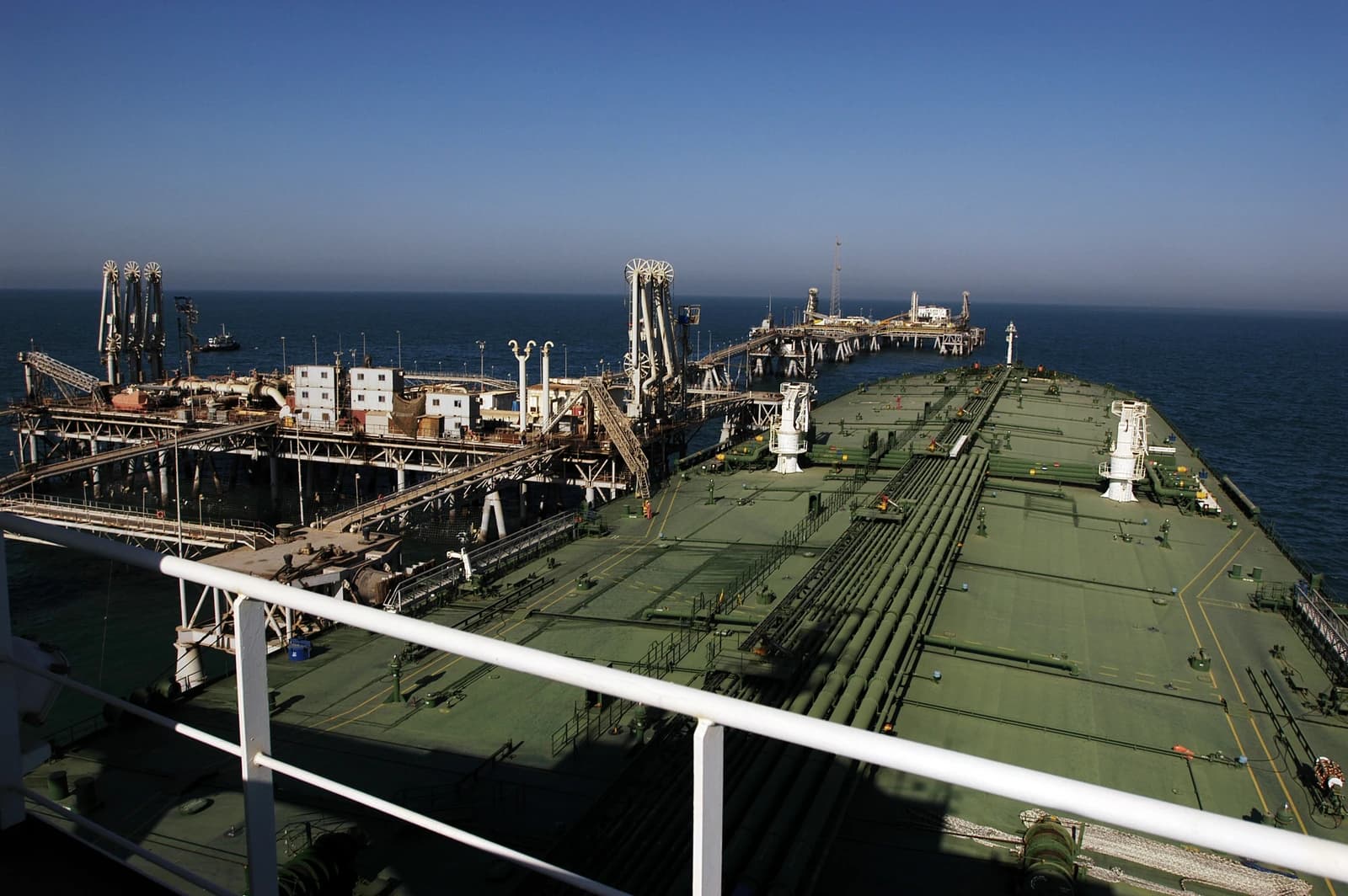An oil tanker docked to the Al Basrah Oil Terminal takes on crude oil in the Persian Gulf.