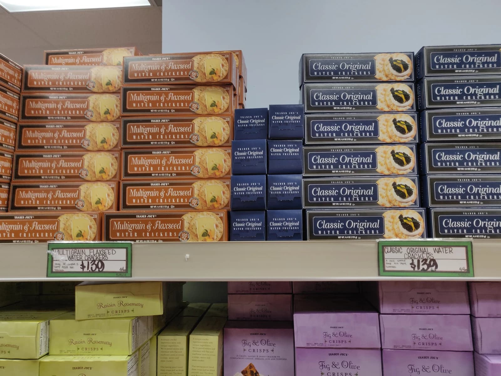 Boxes of 'Multigrain & Flaxseed Water Crackers' and 'Classic Original Water Crackers' on shelves.