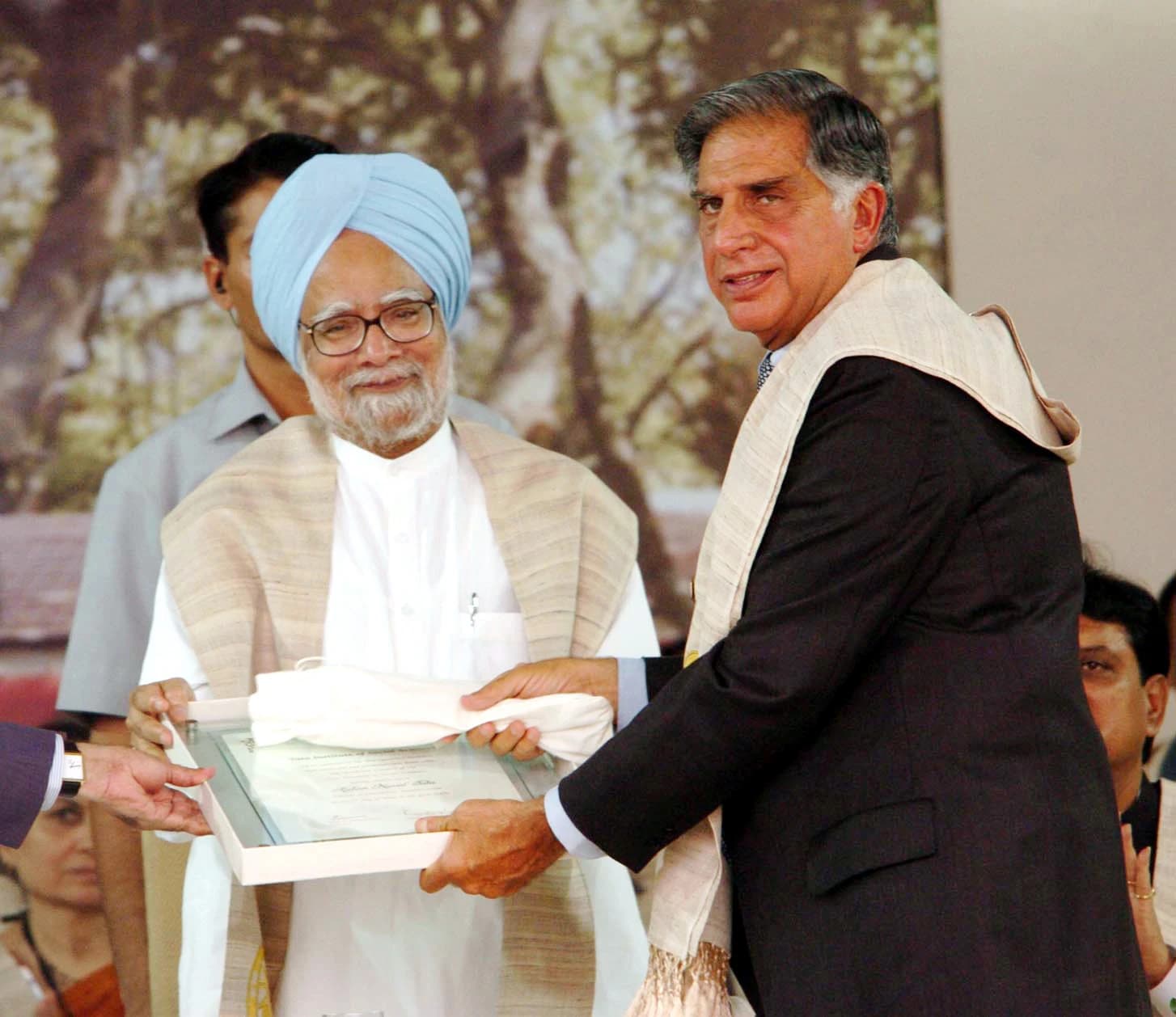 Ratan Tata, receiving an honorary doctorate degree from Manmohan Singh.