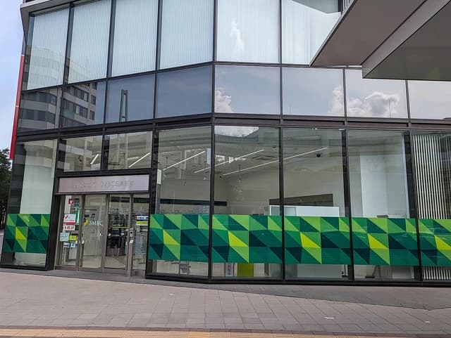 Exterior view of the glass-fronted Sumitomo Mitsui Banking Corporation branch.