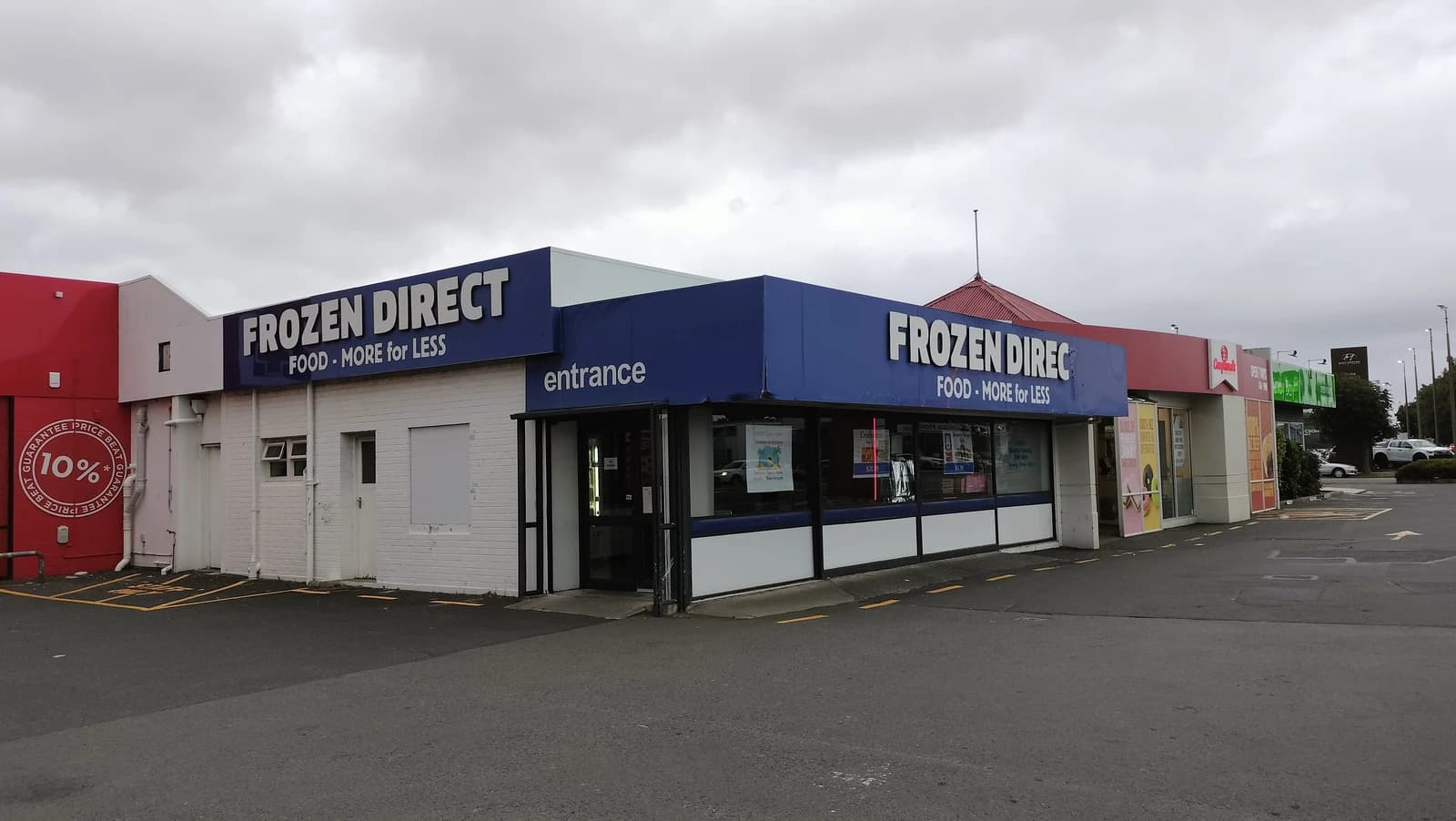Exterior view of the Frozen Direct supermarket store entrance in Dunedin.