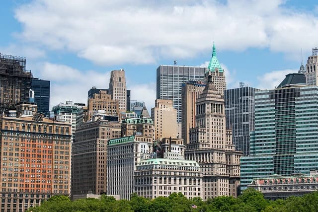 Skyscrapers and historic buildings in the Financial District of New York City.
