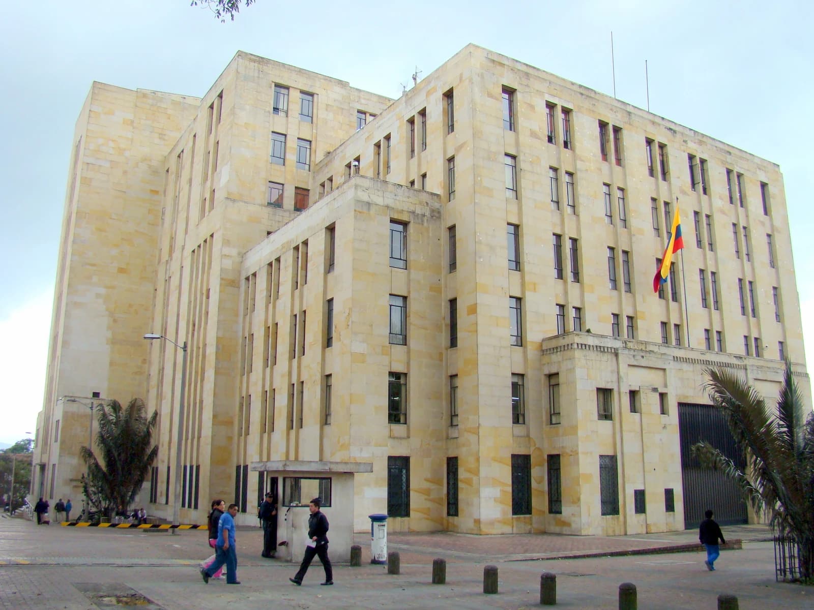 Ministry of Finance and Public Credit building, Bogota, Colombia with people walking outside.