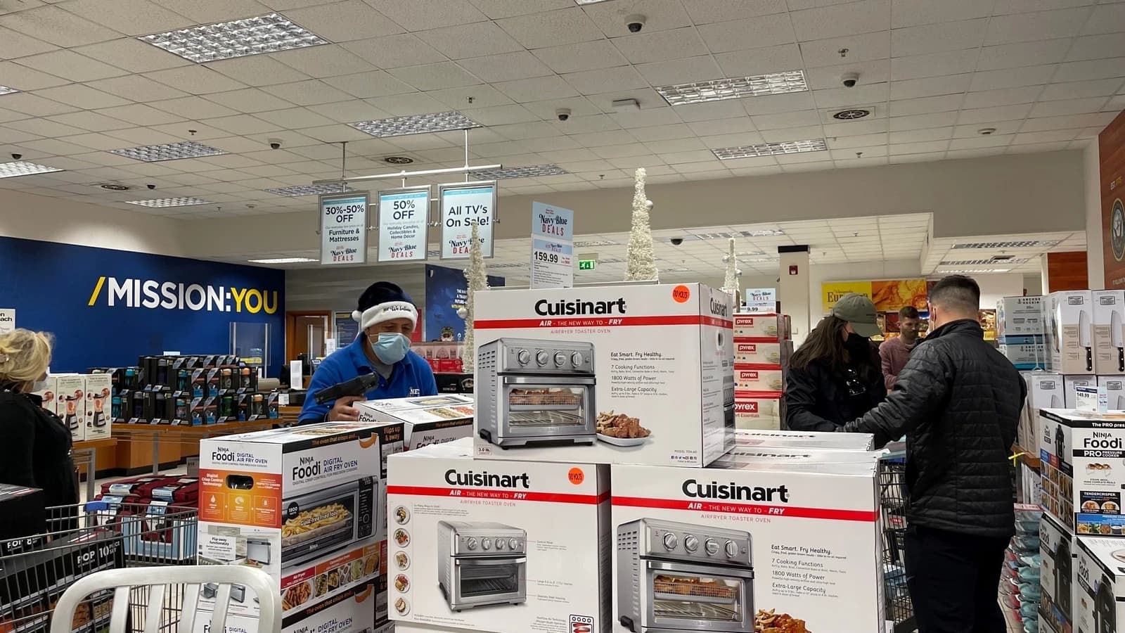 People shopping at a NEX store during holiday sales.
