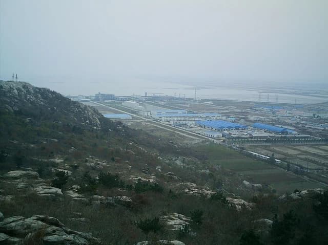 Aerial view of the industrial buildings and infrastructure of Tianwan Nuclear Power Station.