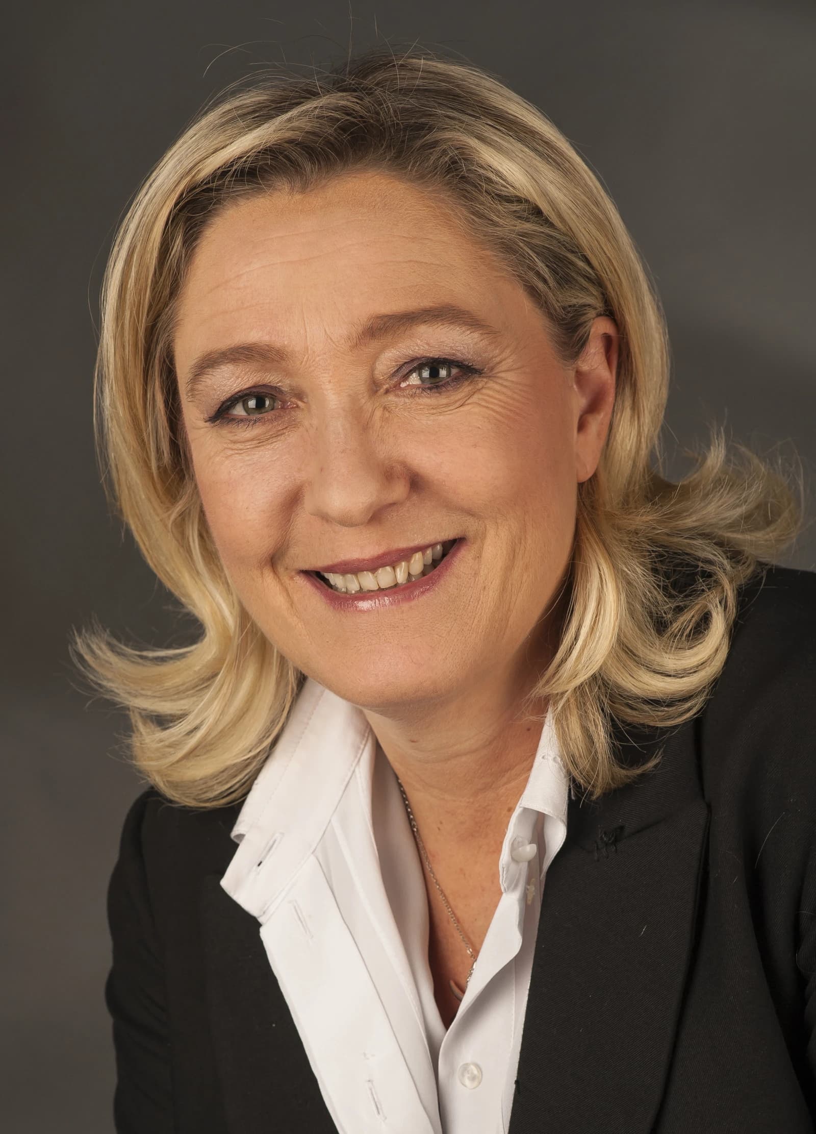 Marine Le Pen, French politician, smiling at the camera.