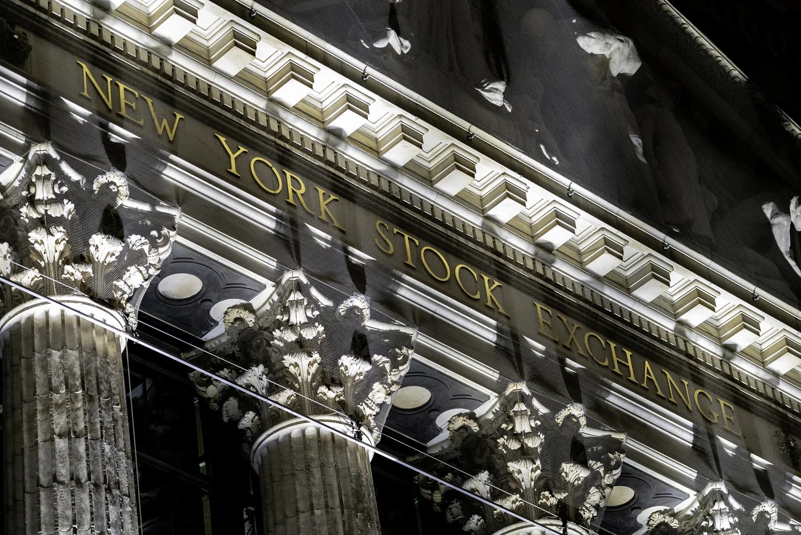 The golden letters "NEW YORK STOCK EXCHANGE" on the building facade.