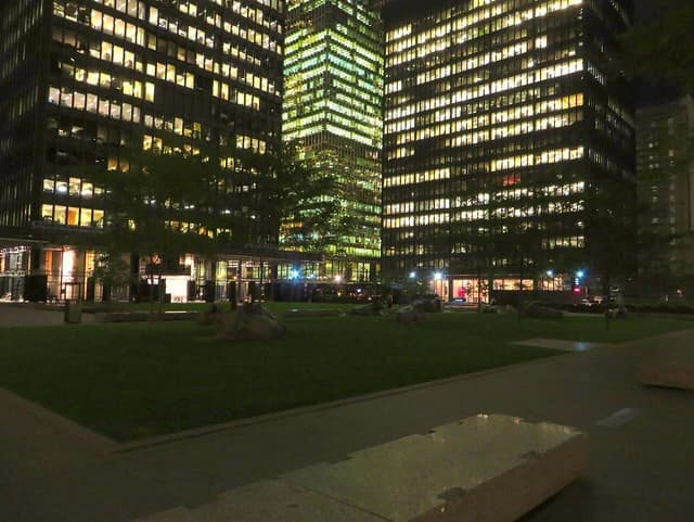 Toronto-Dominion Centre building complex with illuminated windows at night.