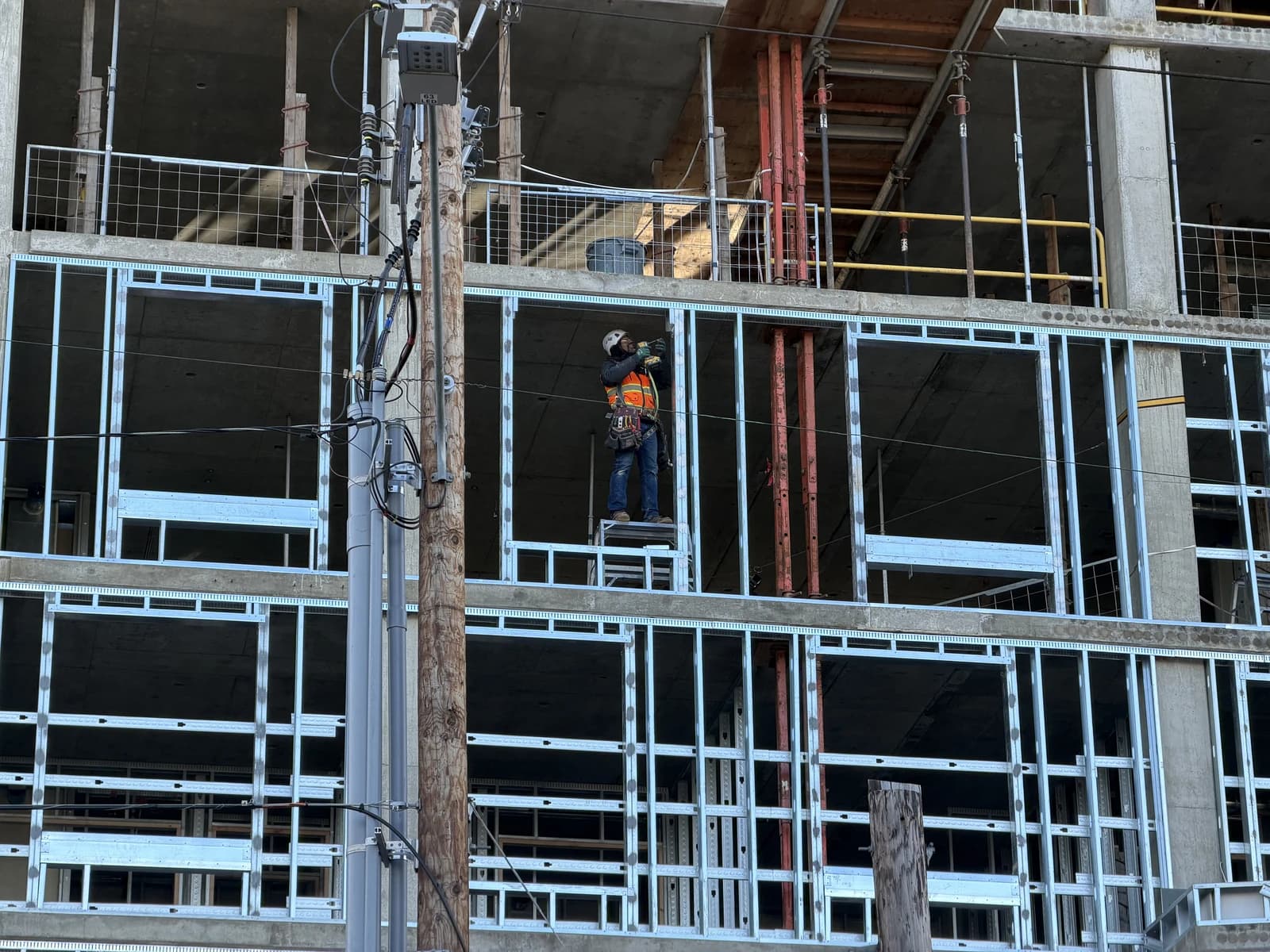 Construction worker assembling steel framing on a building at Hollywood Transit Center.