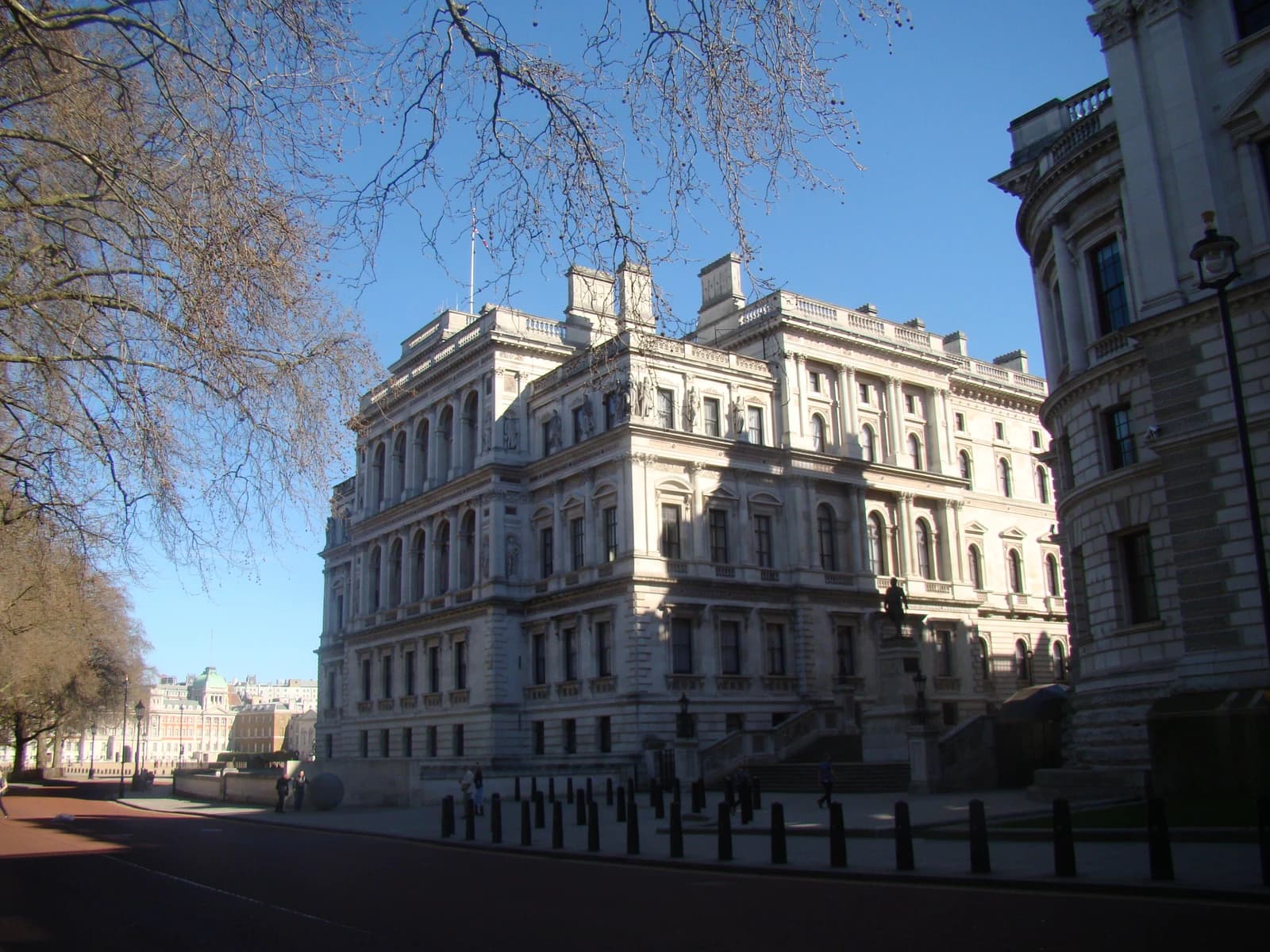 Exterior view of the HM Treasury building in London on a clear day.