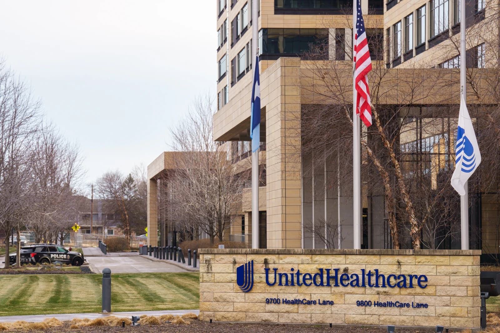 UnitedHealthcare Corporate Headquarters building exterior with flags and signage.