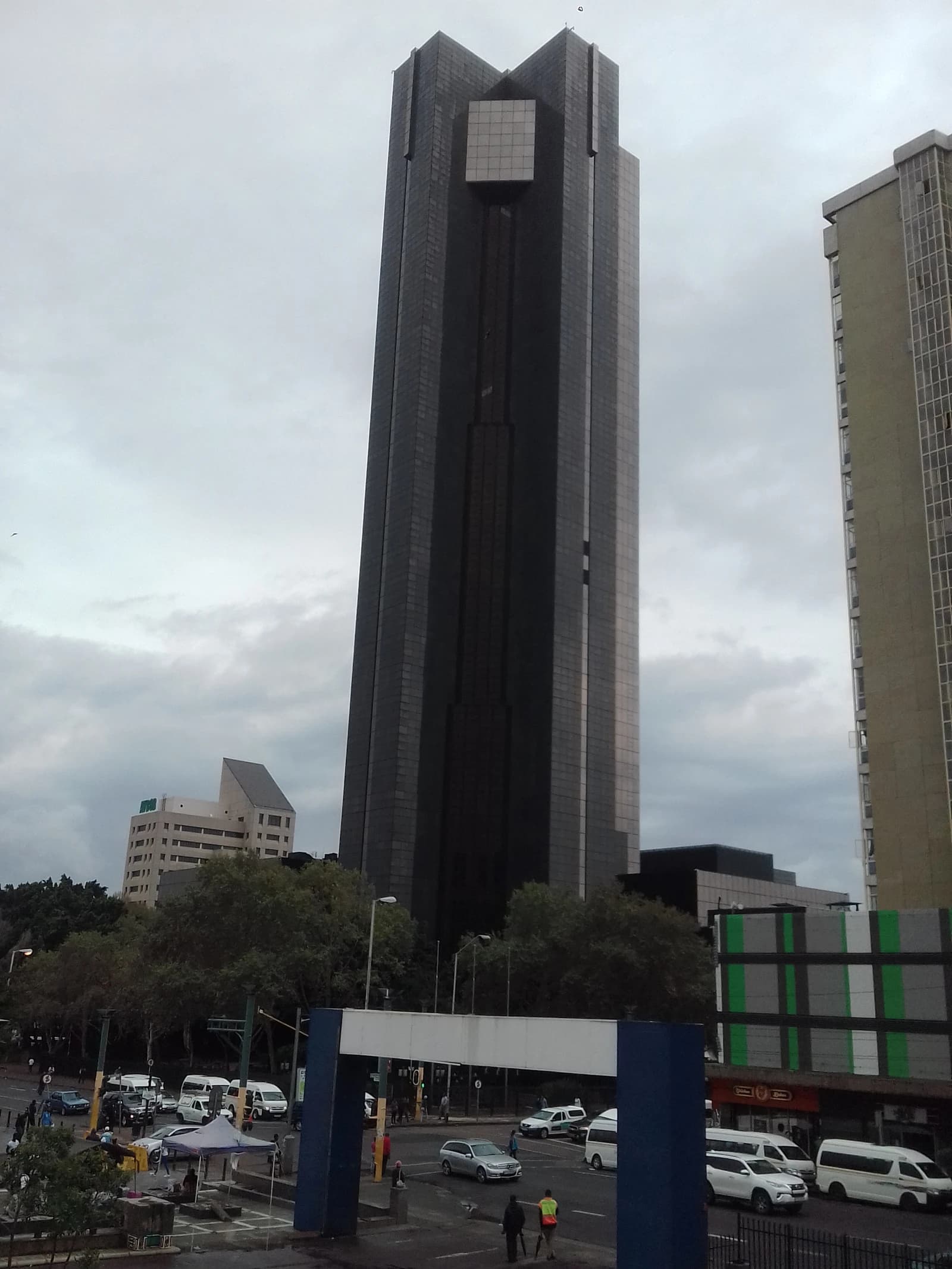 South African Reserve Bank building, a tall, dark skyscraper, in Pretoria.