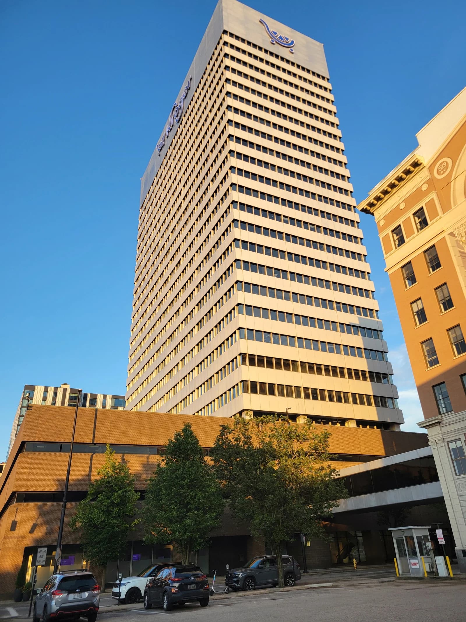 Kroger company headquarters building, a tall corporate structure, seen from an urban street.