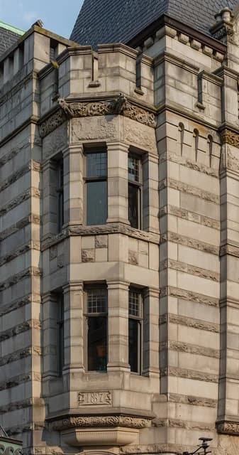 Detail of the Bank of Montreal Building with stone facade and ornate architectural elements.