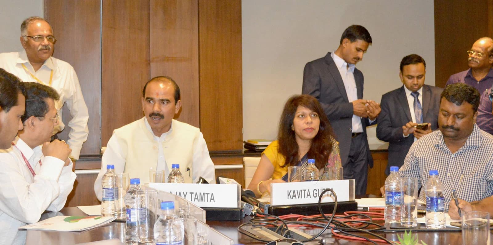 Shri Ajay Tamta, Minister of State for Textiles, speaking at a conference table.