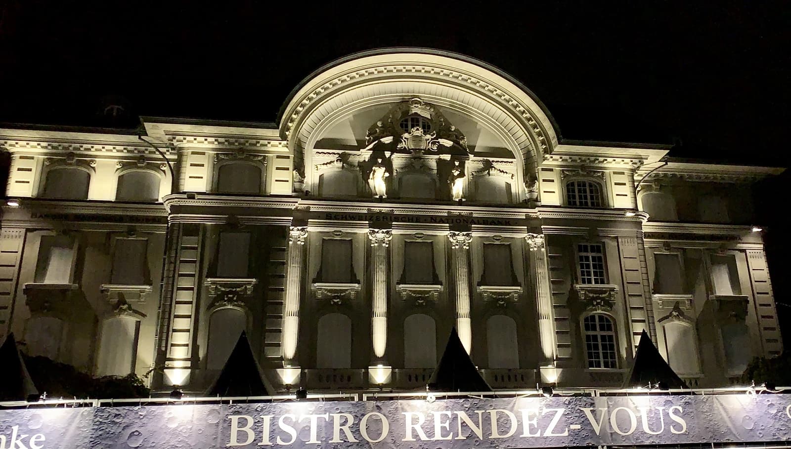 Swiss National Bank headquarters illuminated at night in Bern, Switzerland.