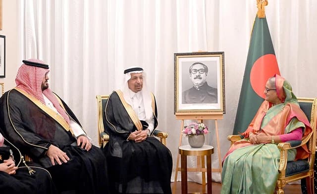 Saudi Investment Minister Khalid Al Falih and Saudi Economy Minister Faisal Alibrahim sit with Prime Minister Sheikh Hasina.