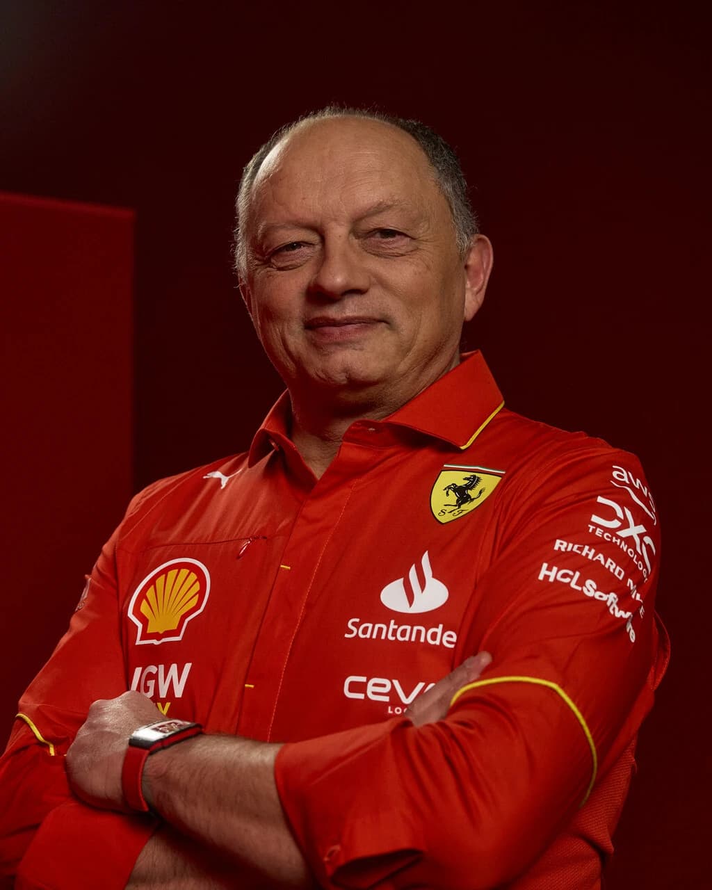 Frédéric Vasseur, Scuderia Ferrari Team Principal, standing with arms crossed, smiling.