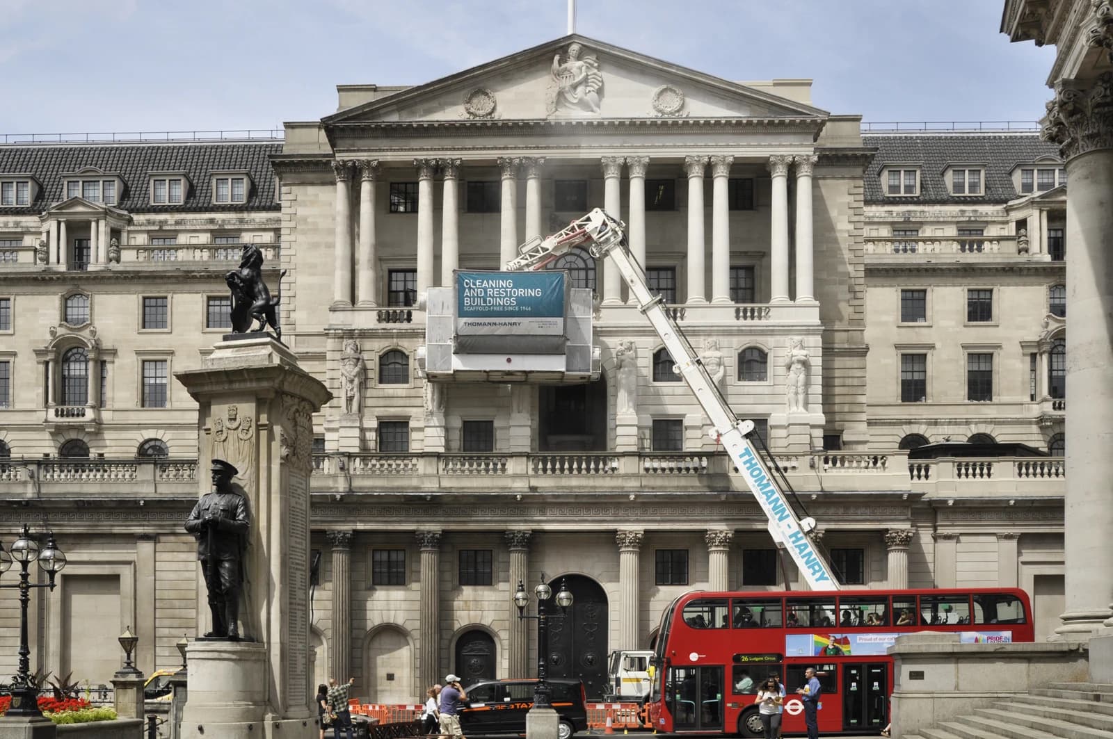 The Bank of England building facade in London, with a cleaning apparatus.