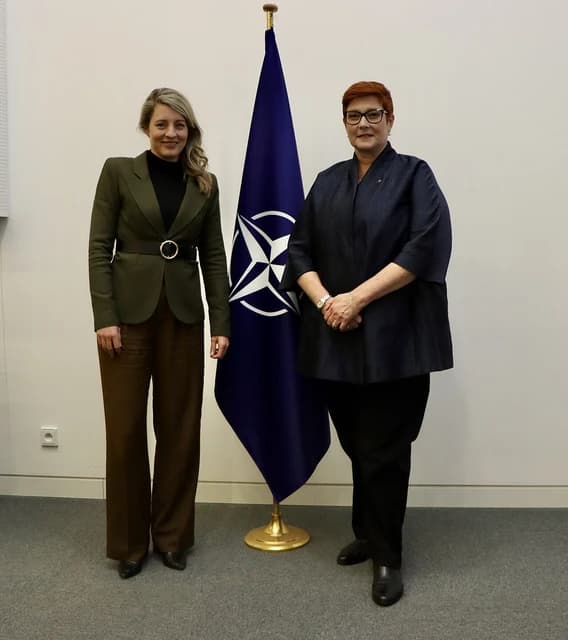 Australian Foreign Minister Penny Wong and Canadian Foreign Minister Mélanie Joly standing in Brussels.