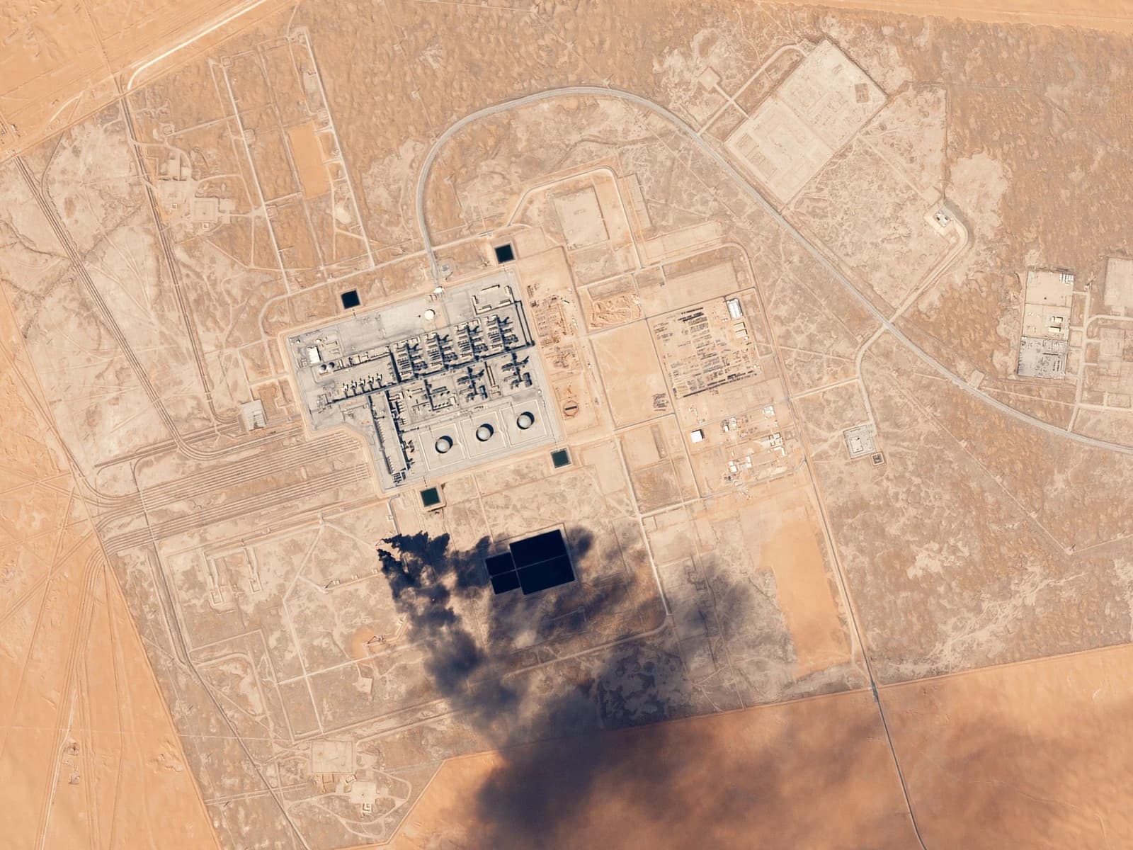 Aerial view showing the Khurais Oil Processing Facility, a large industrial complex in a desert.