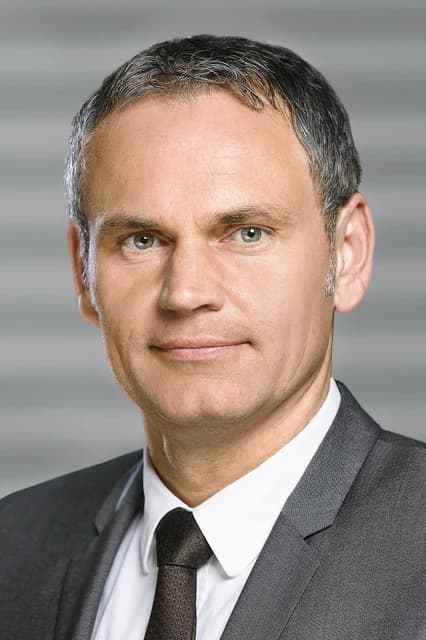 Dr. Oliver Blume, CEO of Porsche AG, looking directly at the camera.