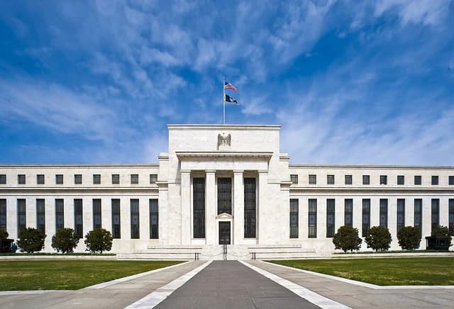 Exterior of the Federal Reserve's Eccles Building in Washington, D.C. on a clear day.