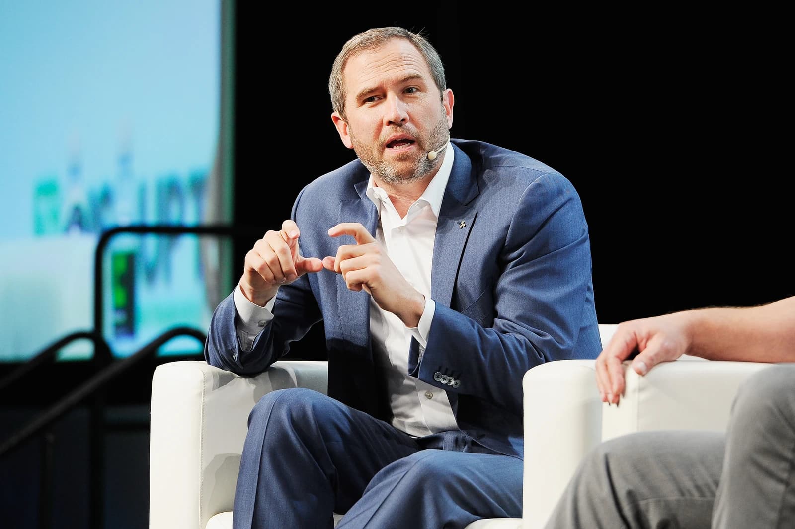 Brad Garlinghouse, CEO of Ripple, speaking at a conference.