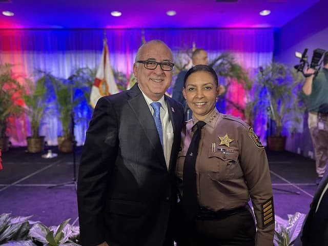 Hialeah Mayor Esteban Bovo and Sheriff Rosie Cordero-Stutz pose for a photo.