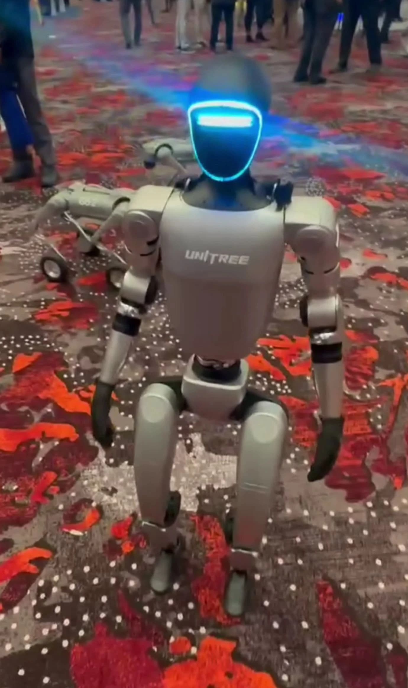 Unitree G1 humanoid robot displayed on a patterned floor.