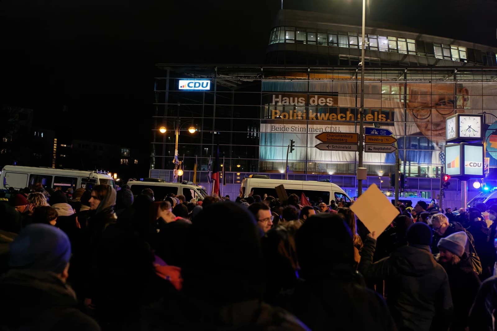 Protesters gathered at night outside the CDU party headquarters in Berlin, Germany.