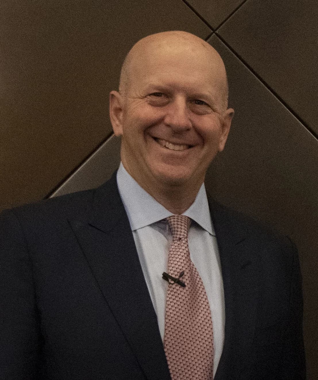 David Solomon, CEO of Goldman Sachs, smiling while wearing a suit and tie.