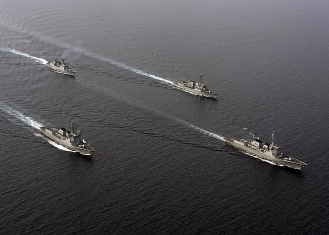 Republic of Korean ships and U.S. Navy missile destroyer USS Spruance sailing together.