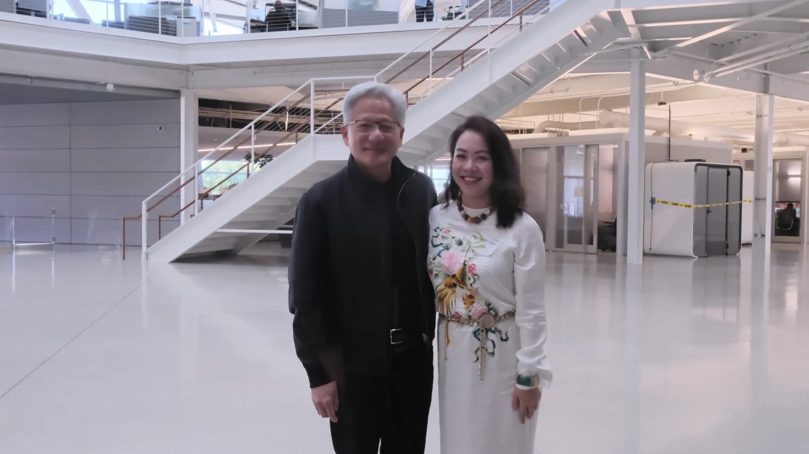 NVIDIA Founder and CEO Jensen Huang with Director Lê Nguyễn Thiên Nga standing indoors.