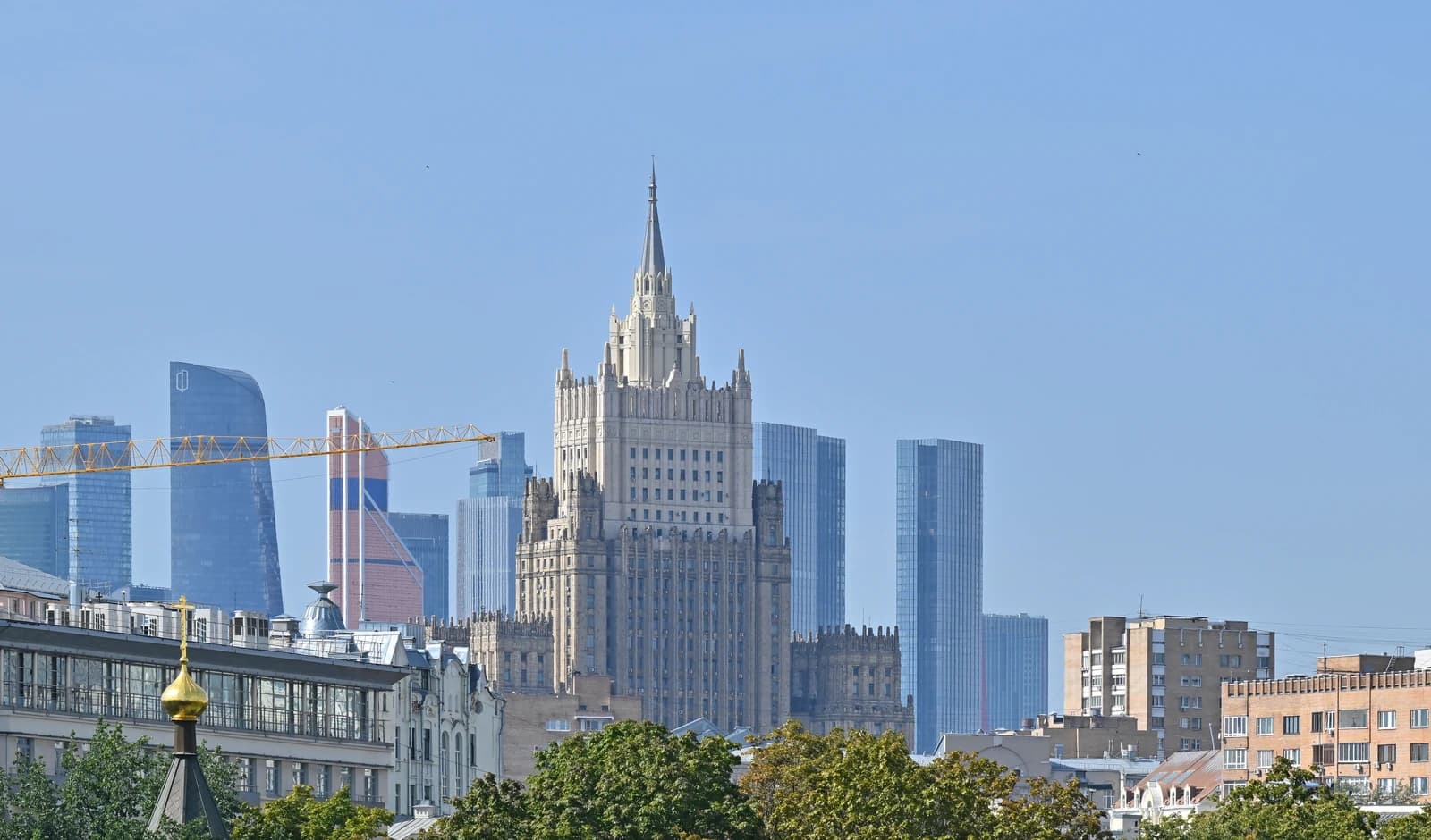 Ministry of Foreign Affairs building in Moscow with modern skyscrapers in the background.