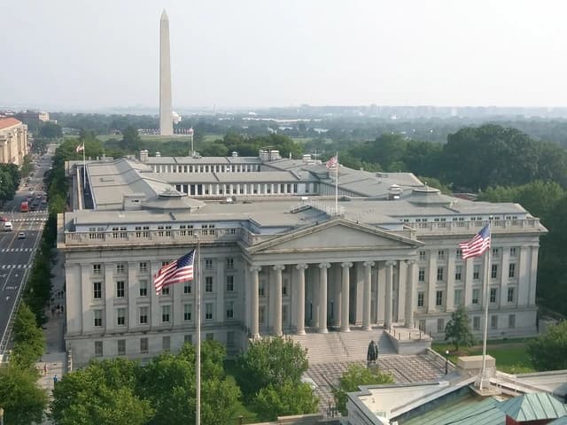 Aerial view of the US Treasury Building in Washington D.C. with the Washington Monument.