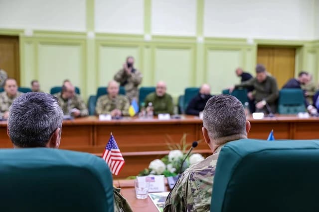 Military personnel, including Ukrainian Defense Minister Oleksiy Reznikov, attending a meeting.