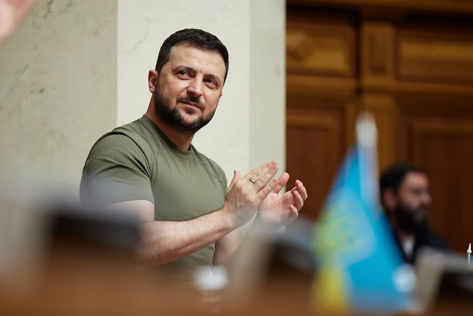 Volodymyr Zelenskyy, President of Ukraine, clapping in the Verkhovna Rada.
